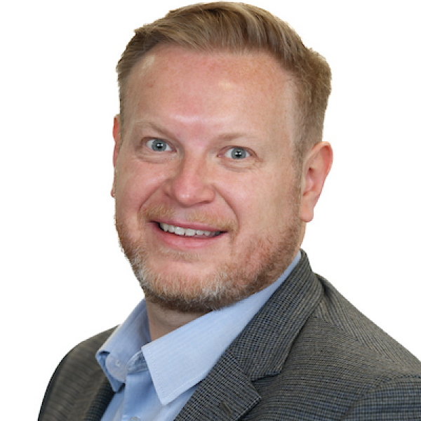 Portrait photograph of Brian Lee, Chief Executive Officer.